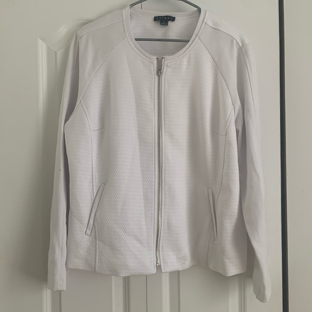 White jacket with nice pattern , arms are in stretch material.